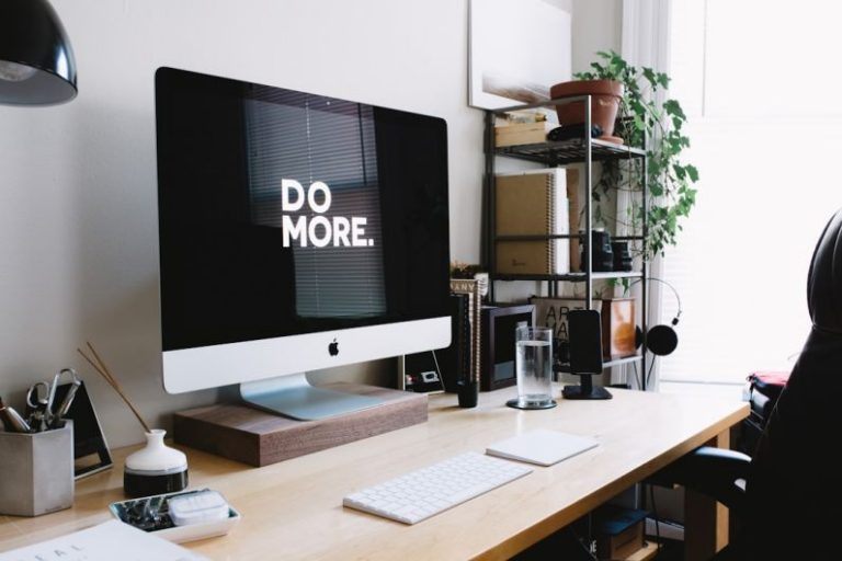 Energy-efficient Gadgets - silver iMac with keyboard and trackpad inside room