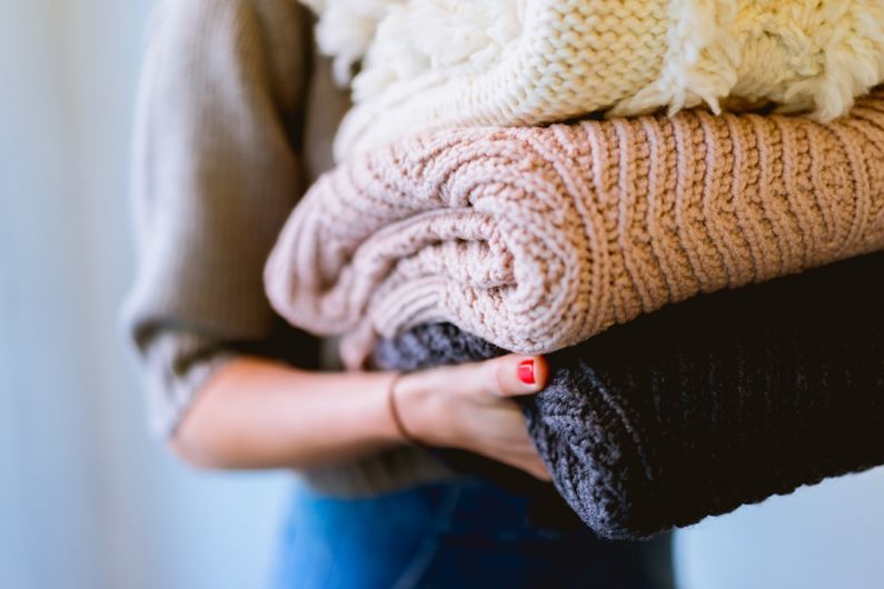 Cleaning Closet - person holding knitted textiles